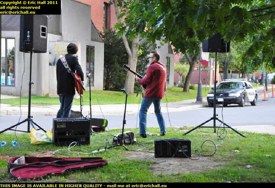 buskers with police interaction harvest jazz and blues festival fredericton new brunswick canada