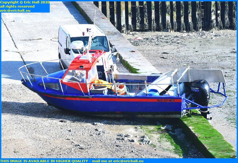 small outboard motor boat beached port de granville harbour manche normandy france eric hall