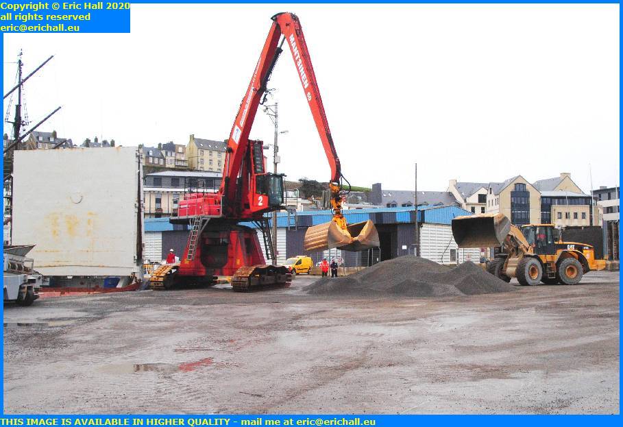 digger crane loading gravel neptune port de granville harbour manche normandy france eric hall