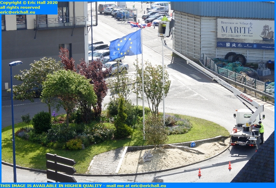 removing british flag union jack place godal granville manche normandy france eric hall