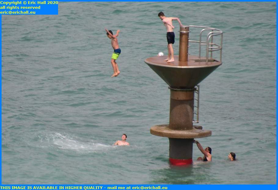 kids jumping from diving platform plat gousset granville manche normandy france eric hall