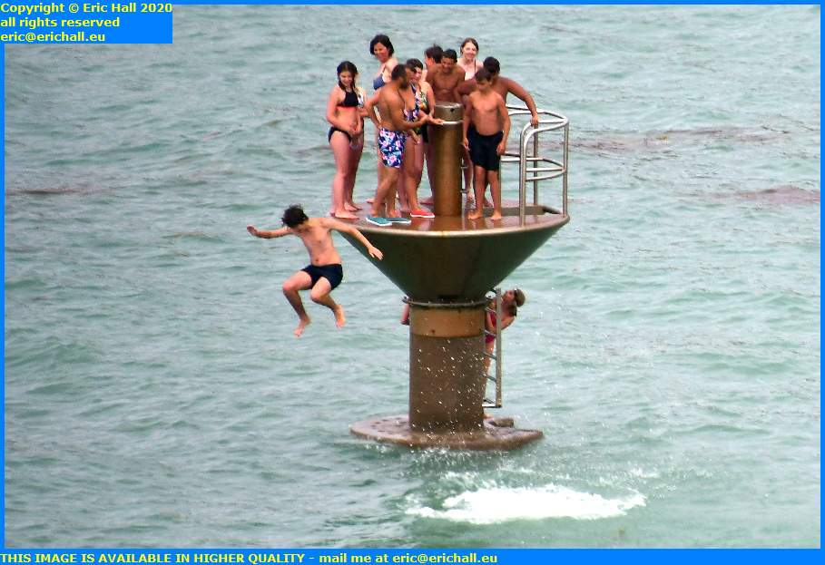 kids jumping from diving platform granville manche normandy france eric hall
