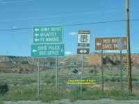 Route 66 signposts to everywhere interesting New Mexico