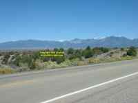 Highway 68 near Taos looking in the direction of Taos and the snow covered mountains behind