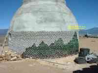 beer bottle and beer can wall earthship Highway 64 near Taos New Mexico
