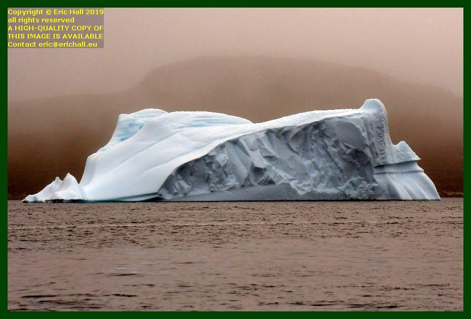 iceberg in the early morning fog Prins Christians Sund greenland Eric Hall
