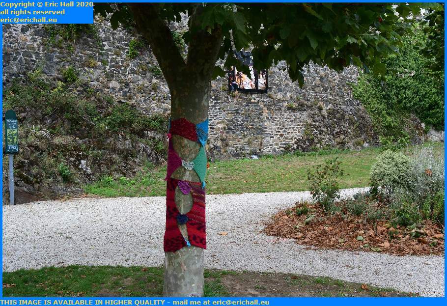tree trunks wrapped in woollen texture square maurice marland granville manche normandy france eric hall