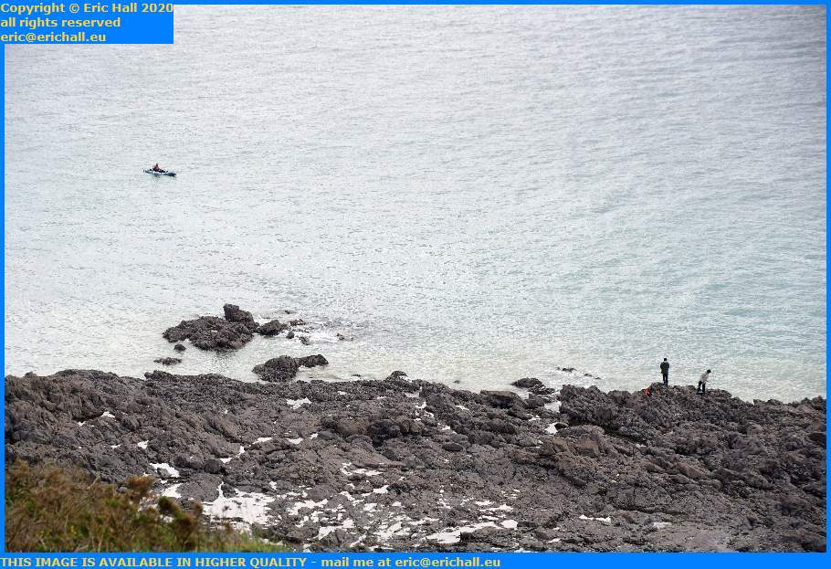 Man in Kayak Fishing From Rocks Pointe du Roc Granville Manche Normandy France Eric Hall