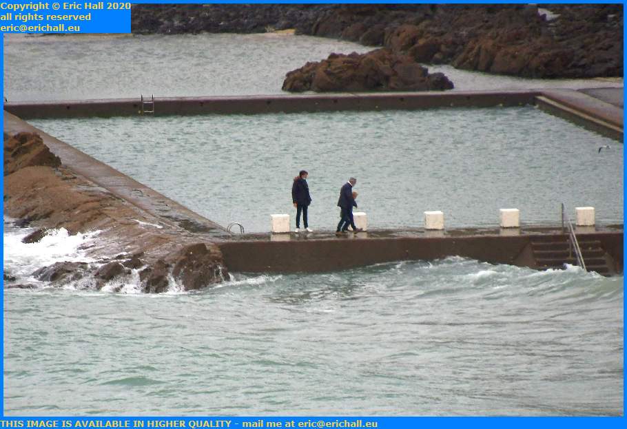 people walking around tidal swimming pool plat gousset Granville Manche Normandy France Eric Hall