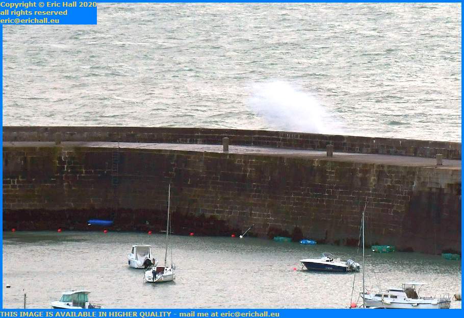 waves crashing over sea wall port de Granville harbour Manche Normandy France Eric Hall