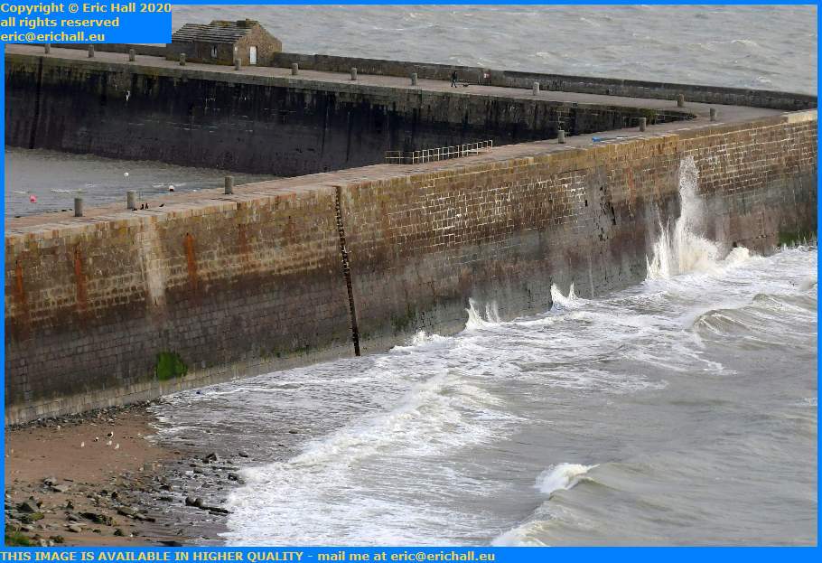 waves on sea wall port de Granville harbour Manche Normandy France Eric Hall