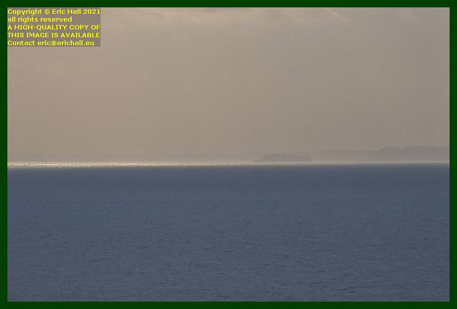 sun on sea cliffs ile des rimains brittany coast Granville Manche Normandy France Eric Hall