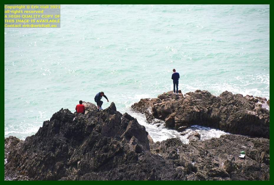 people fishing from rocks pointe du roc Granville Manche Normandy France Eric Hall