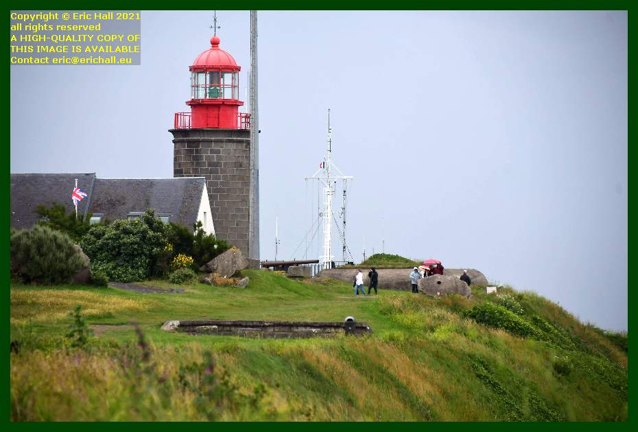people on path in rain lighthouse semaphore pointe du roc Granville Manche Normandy France Eric Hall