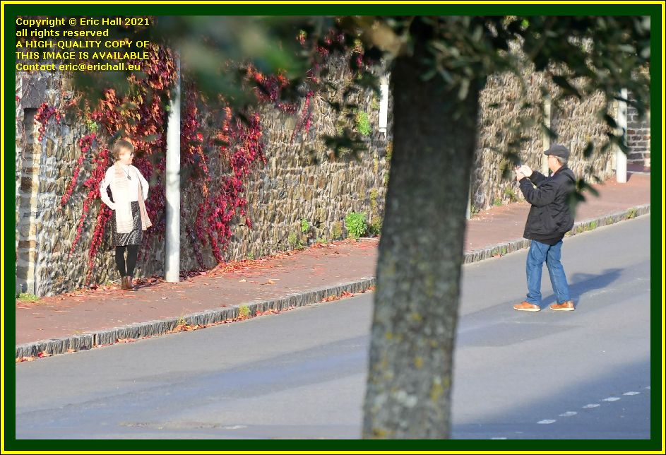 people taking photographs boulevard vaufleury Granville Manche Normandy France Eric Hall photo November 2021