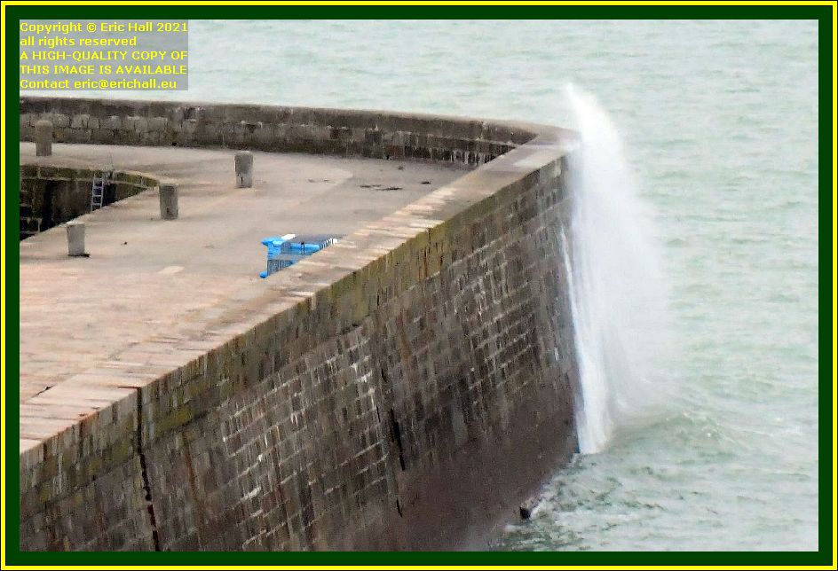 waves on sea wall port de Granville harbour Manche Normandy France photo Eric Hall december 2021