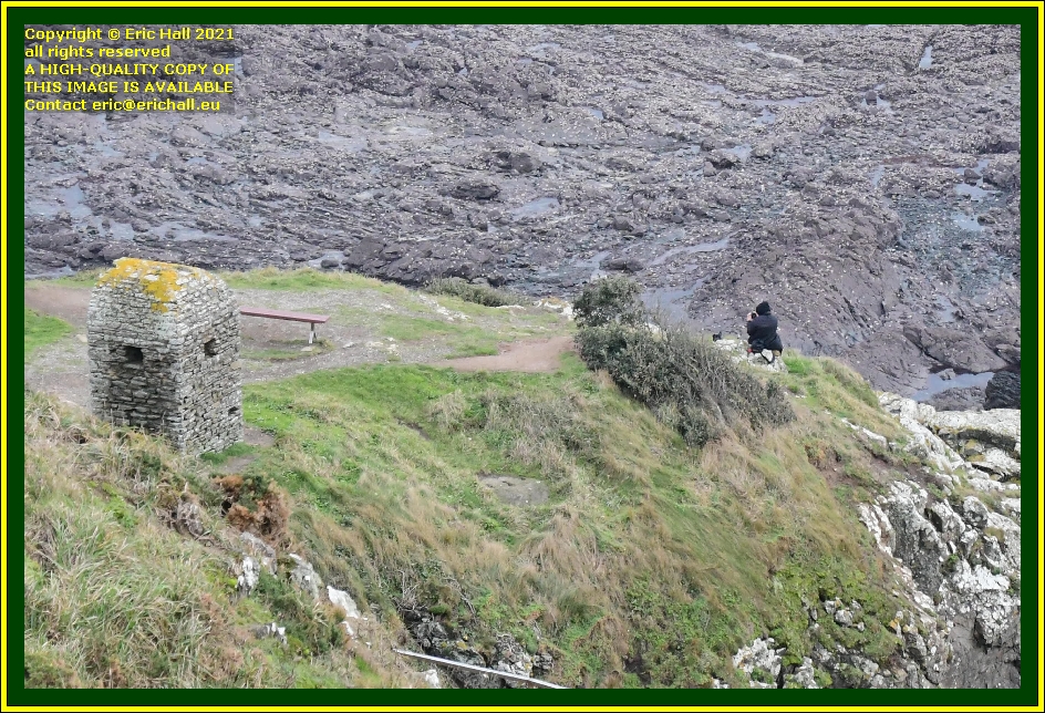 person on rocks pointe du roc Granville Manche Normandy France Eric Hall photo December 2021