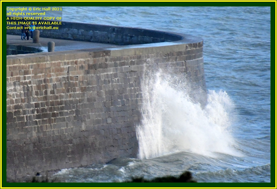 waves on sea wall port de Granville harbour Manche Normandy France photo Eric Hall december 2021