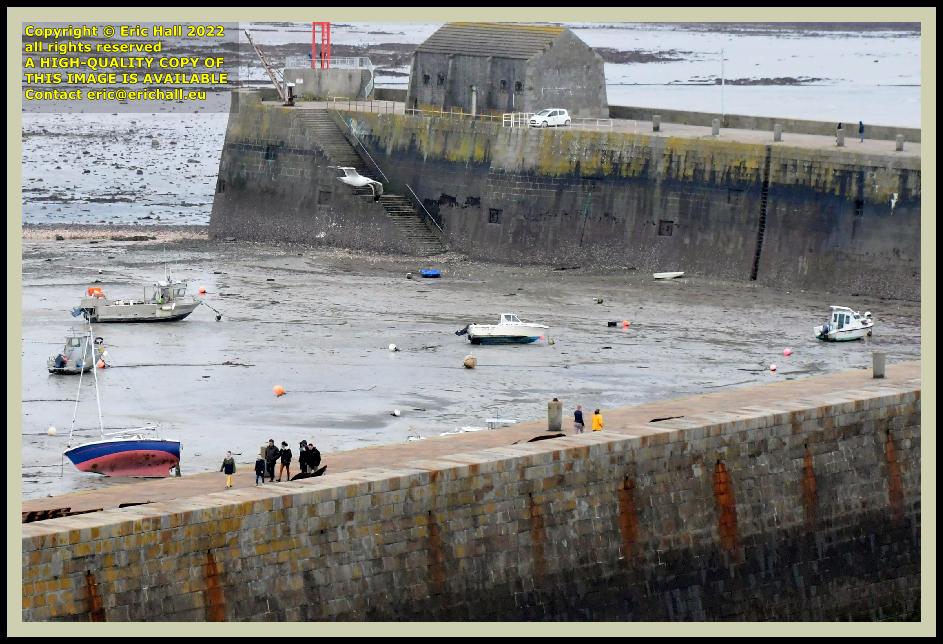 people on sea wall port de Granville harbour Manche Normandy France Eric Hall photo February 2022