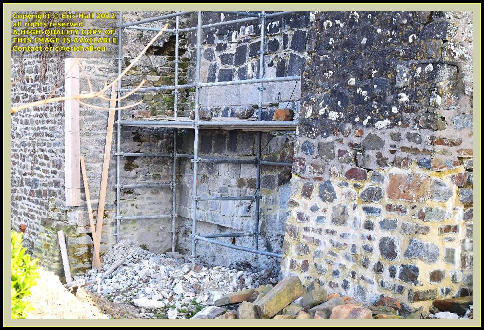 repairing medieval city walls place du marché aux chevaux Granville Manche Normandy France Eric Hall photo March 2022