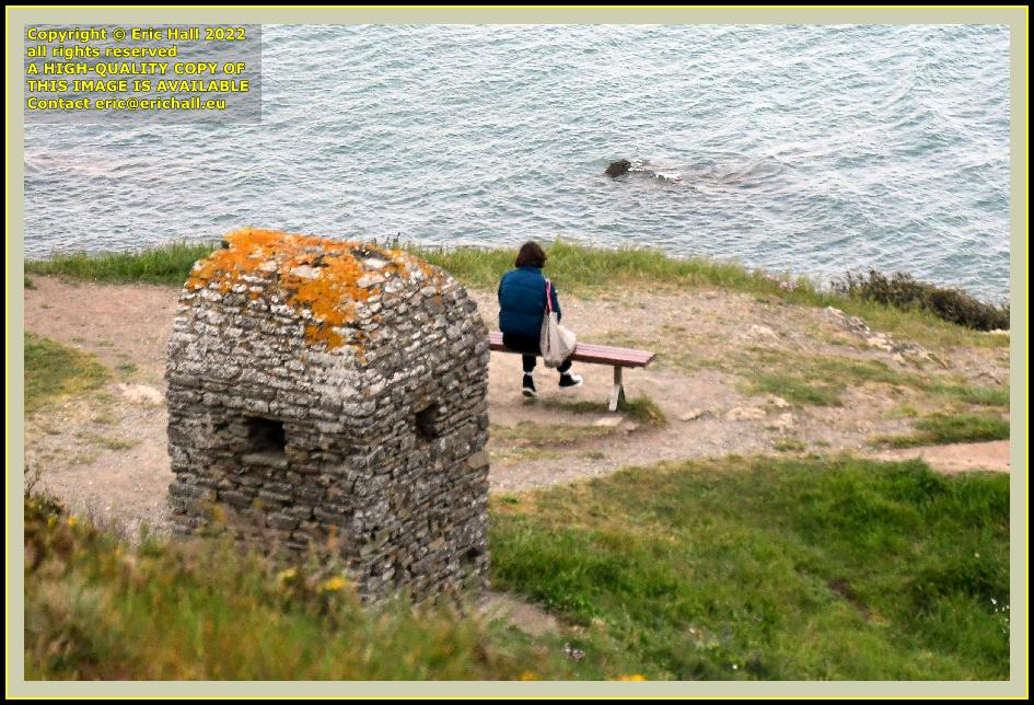 cabanon vauban person sitting on bench Granville Manche Normandy France photo Eric Hall april 2022