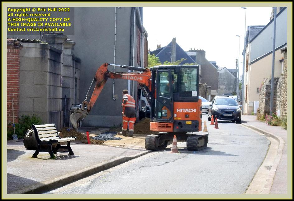 digger working in rue de la houle Granville Manche Normandy France photo Eric Hall may 2022