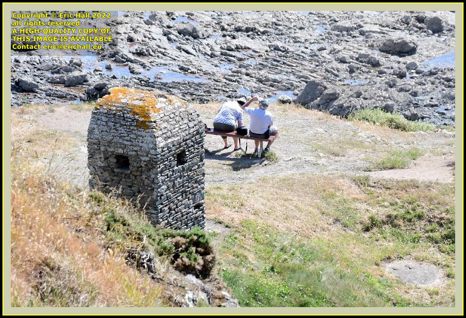 people on bench cabanon vauban pointe du roc Granville Manche Normandy France photo Eric Hall may 2022