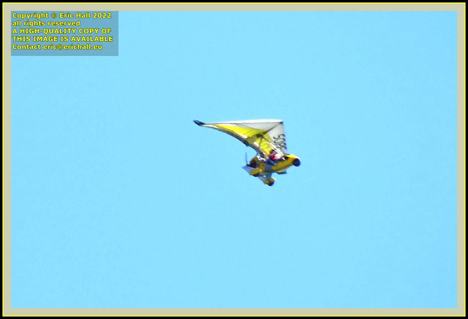 yellow powered hang glider baie de Granville Manche Normandy France photo Eric Hall may 2022