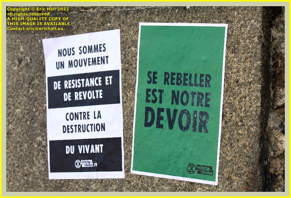 extinction rebellion posters Boulevard des 2E et 202E de Ligne Granville Manche Normandy France Eric Hall photo July 2022